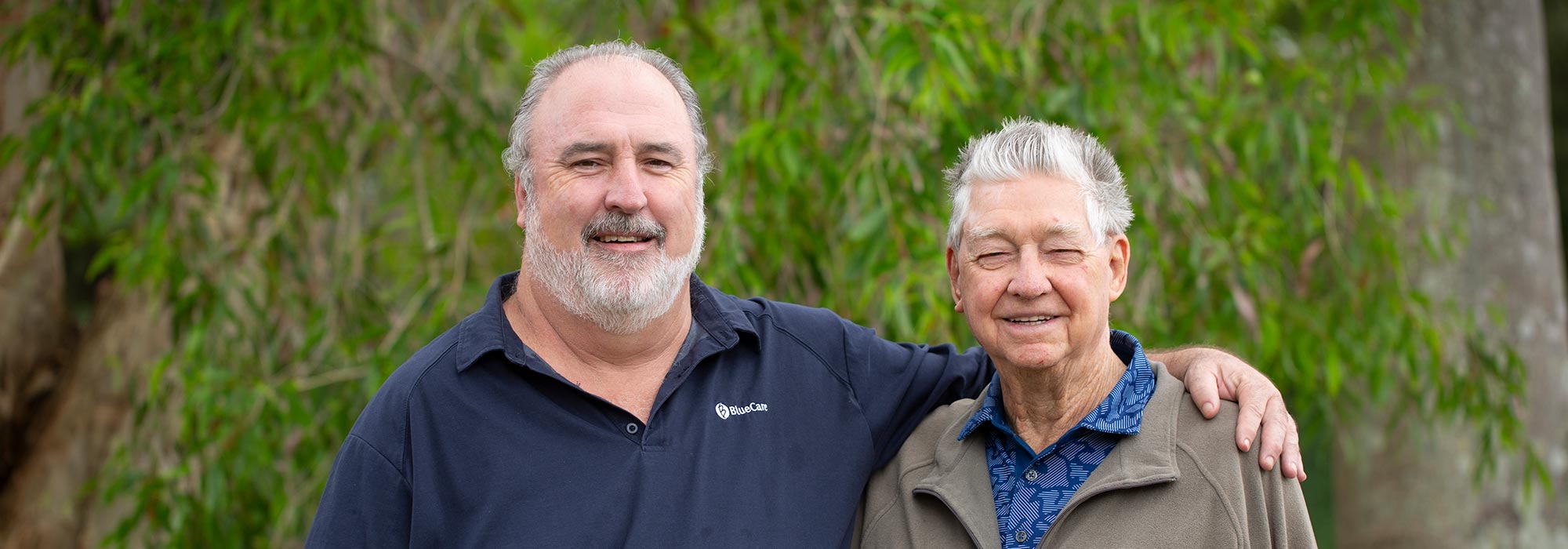 John Miles and Michael Dafel standing together smiling at camera