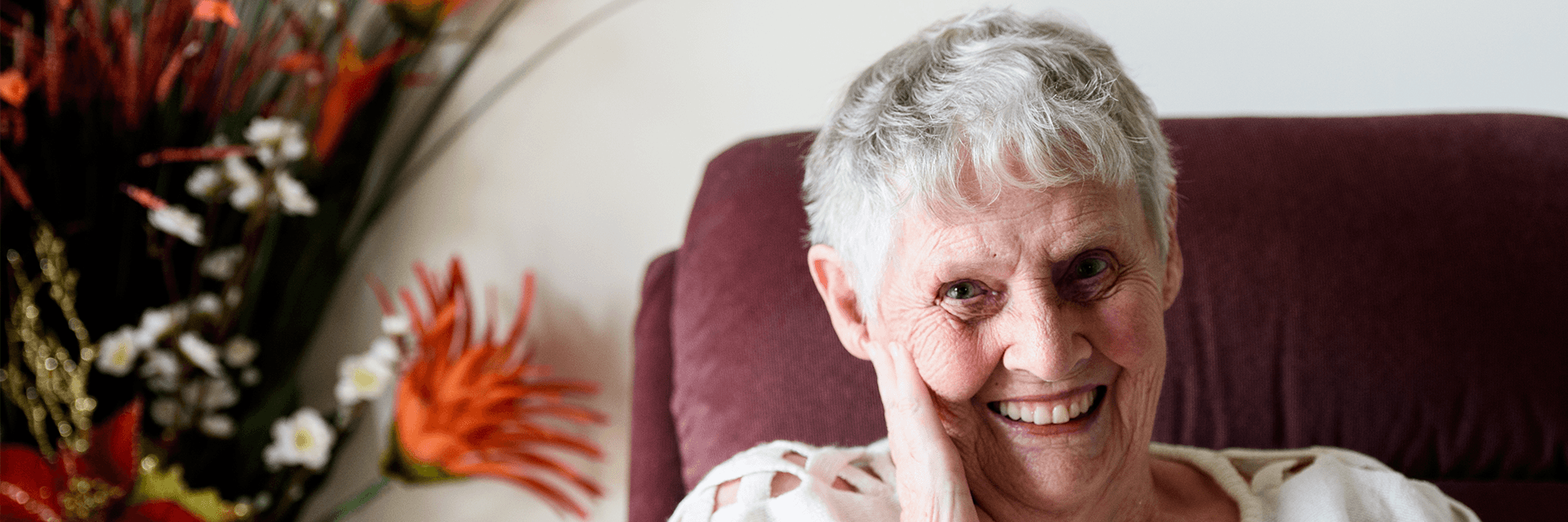 Blue Care residental care client Judith smiles at camera
