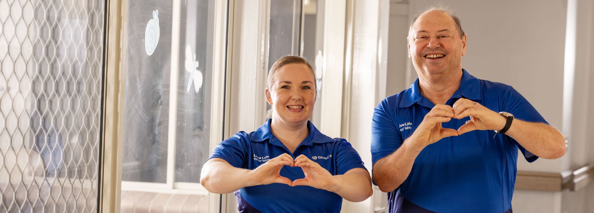 BlueCare team making love heart