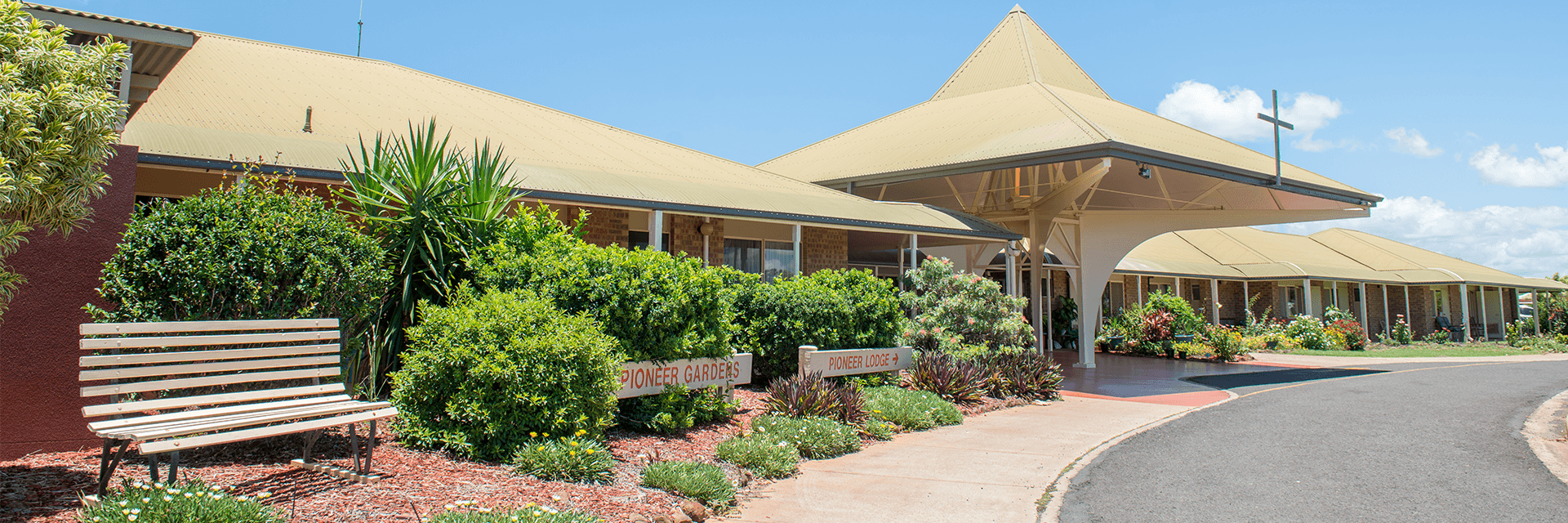 Blue Care Bundaberg Pioneer Aged Care Facility A sunny seat amid the tropical garden at the front of Blue Care Bundaberg Pioneer Aged Care Facility.